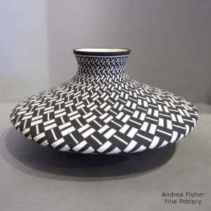 Basket weave design on a black and white flat jar