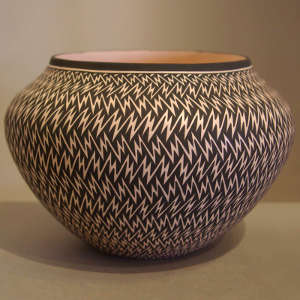 Lightning bolt design on a black and white jar