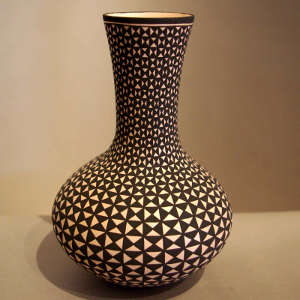 Geometric design on a tall-necked black and white jar