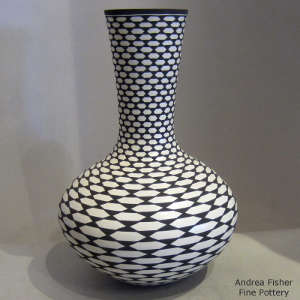 Geometric design on a tall-necked black and white jar