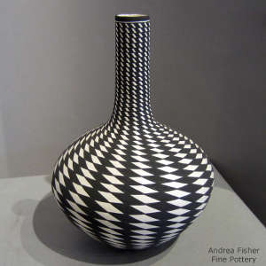 Geometric design on a tall neck black and white vase