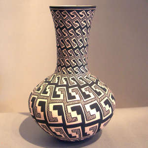 Kiva step and rain design on a black and white tall neck vase