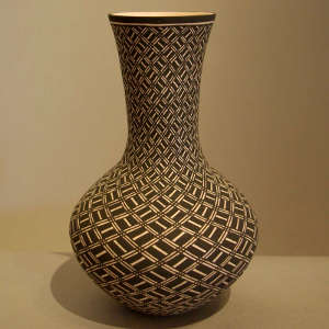 Geometric design on a tall neck black and white vase