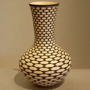 Geometric design on a tall neck black and white vase
