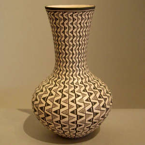 Geometric design on a tall neck black and white vase