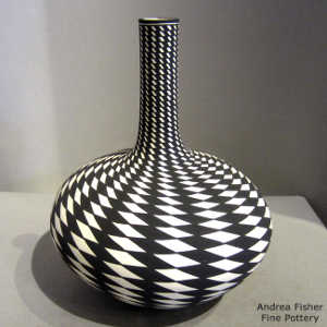 Geometric design on a tall neck black and white vase