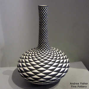 Step swirl geometric design on a tall neck black and white vase