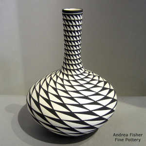 Swirl geometric design on a tall neck black and white vase