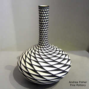 Step geometric design on a tall neck black and white vase