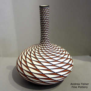 Step swirl geometric design on a tall neck polychrome vase