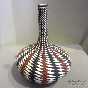 Geometric design on a tall neck polychrome vase