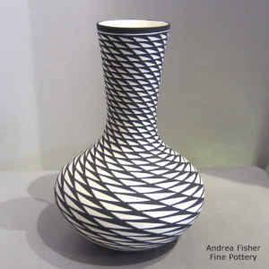 Black and white vase with a spiral mesa geometric design