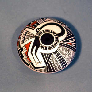 Stylized Mimbres turkey and geometric design on a polychrome seed pot