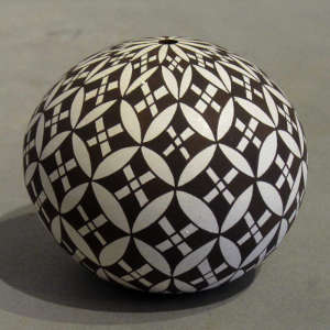 Traditional geometric design on a black and white seed pot
