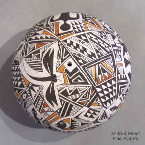 A Mimbres animal and geometric design on a polychrome seed pot