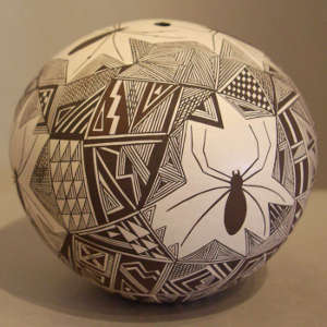 Spider and shard design on a black and white seedpot