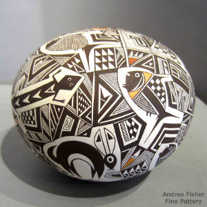 Mimbres animal and shard designs on a polychrome seedpot