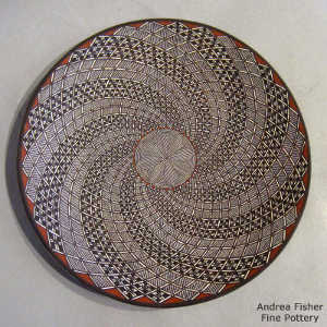 Fine line and swirl geometric design on a polychrome plate