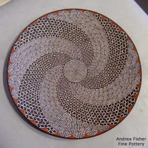Fine line, rain and swirl geometric design on a polychrome plate