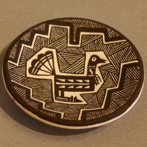Bird, fine line and geometric design on a black and white plate
