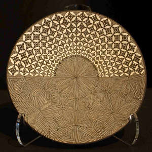 Snowflake fine line and geometric design on a black and white plate