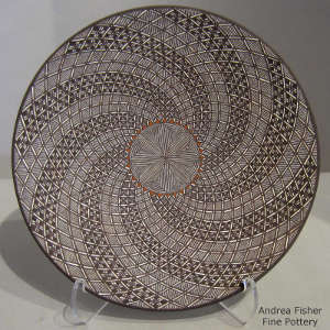 Fine line and swirl geometric design on a polychrome plate