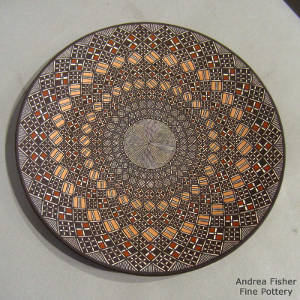 Fine line, swirl and geometric design on a polychrome plate
