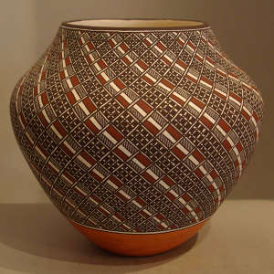 Four color swirl geometric design on a polychrome pot
