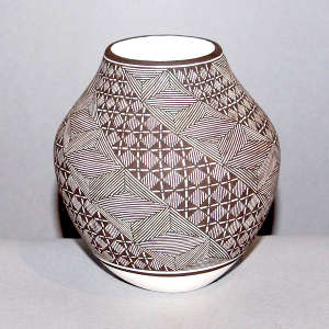 Swirl fine line and geometric design on a black and white jar