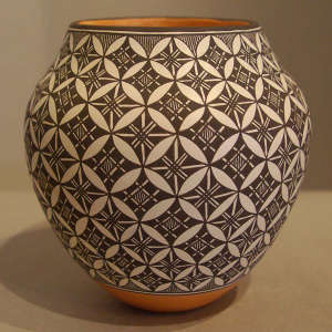 Black and white geometric design on a polychrome jar