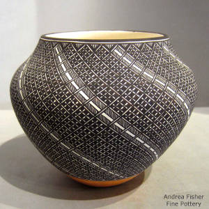 Black and white swirl geometric design on a polychrome jar