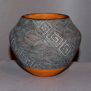 Black and white fine line and geometric design on a polychrome jar