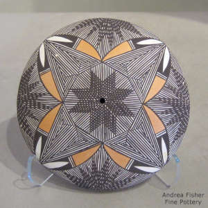 Fine line and geometric design on a polychrome seed pot