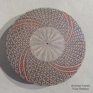 Fine line and geometric design on a polychrome seed pot