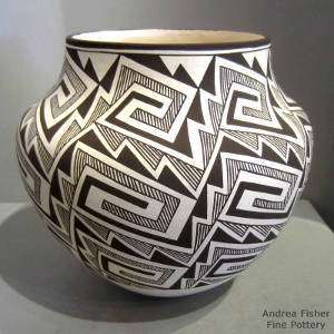 Lightning bolt, rain, kiva step and geometric designs on a black and white olla
