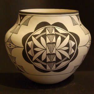 Medallion and geometric designs on a black and white jar