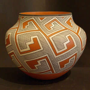 Fine line and geometric designs on a polychrome jar