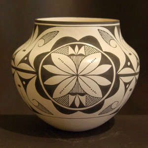 Medallion, floral and geometric design on a black and white jar