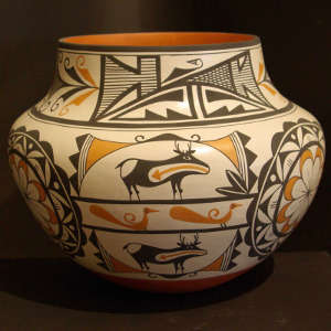 Deer, heart line, medallions and geometric design on a polychrome jar