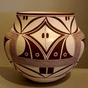 Traditional geometric designs on a black and white jar