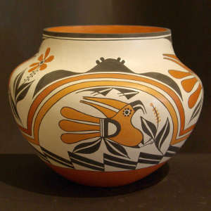 Rainbow, parrot, floral and geometric designs on a polychrome jar