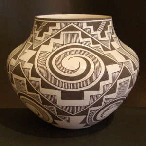 Kiva step, rain, tularosa spiral and geometric designs on a black and white jar