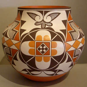 Four medallions and geometric design on a polychrome storage jar