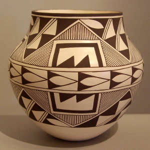 Four panel geometric design on a black and white storage jar