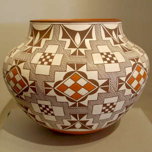 Checkered medallions, fine line and geometric design on a polychrome storage jar