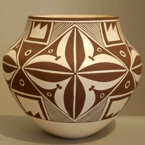 Four panel geographic design on a black and white jar