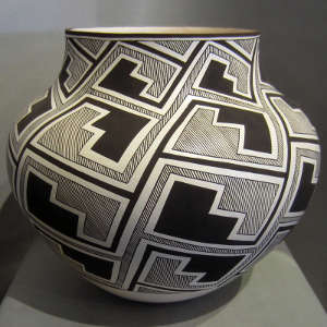 Kiva step interlocking design on a black and white jar