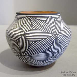 Black and white snowflake fine line design on a polychrome jar