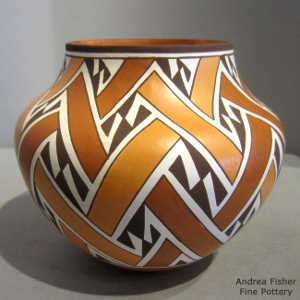 Interlocking lightning bolt and geometric design on a polychrome jar