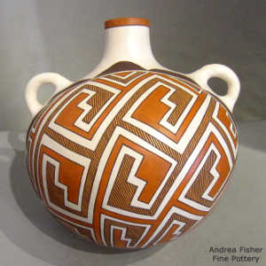 Interlocking kiva step and geometric design on a polychrome canteen